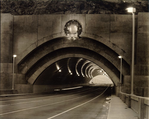 A black and white photo of the first holiday wreath placed above the Yerba Buena Tunnel.