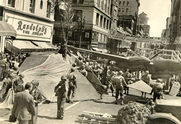 Soldiers in full combat gear and a fighter plane in the middle of a San Francisco street