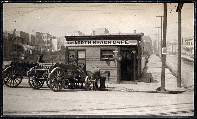 Horse-drawn carts in front of a restaurant